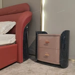 Curved High-Gloss Nightstand with Textured Drawer Panels and Oval Pulls